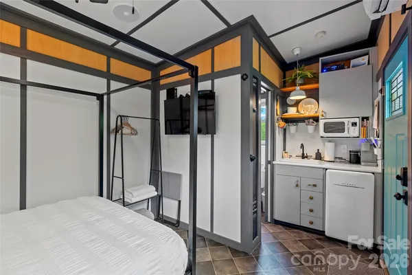 a bathroom with a bathtub and shower