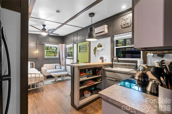 a living room with furniture and a flat screen tv