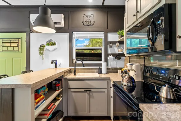 a kitchen that has a lot of cabinets in it