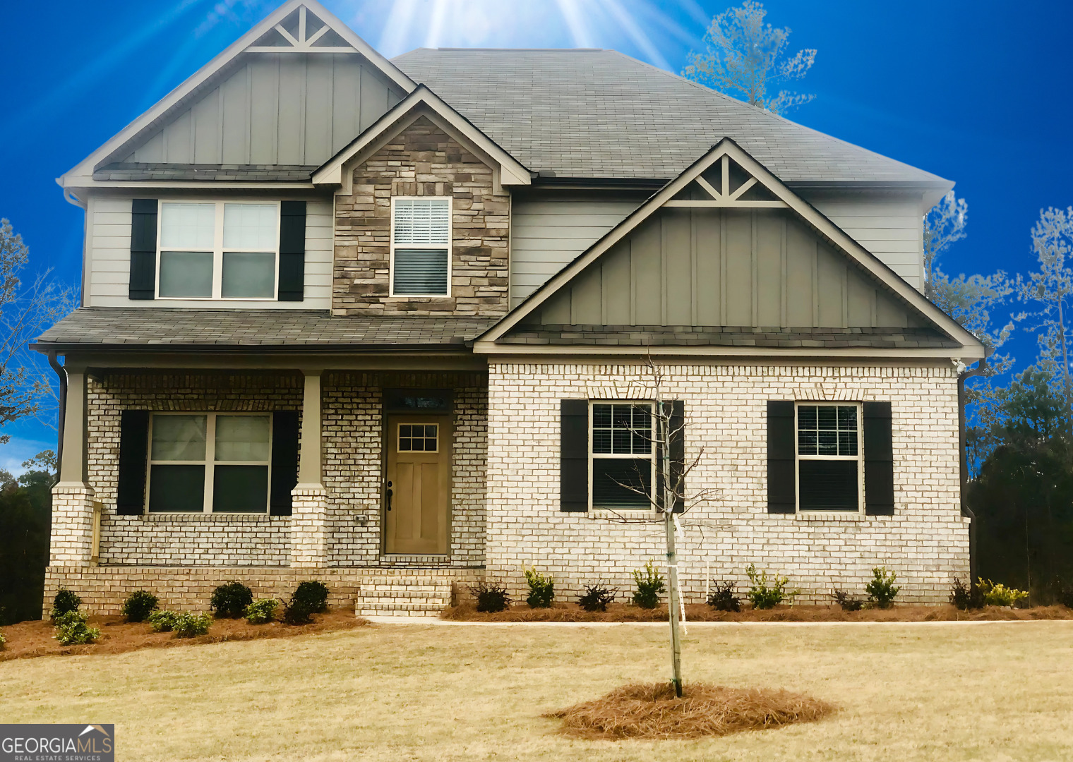 a front view of a house with a yard