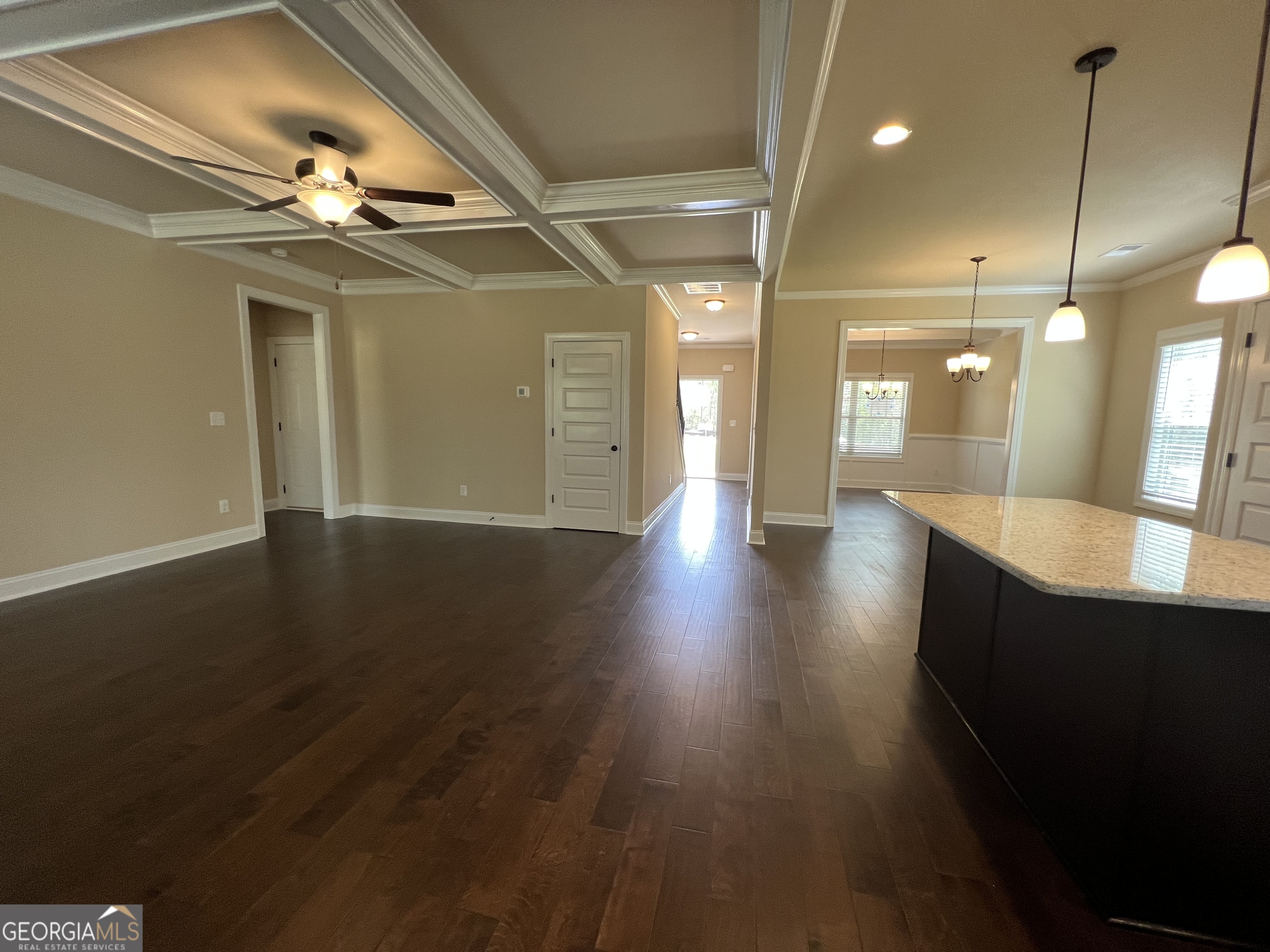 341 Homestead Circle Forsyth, GA 31029 - Photo 13 of 38 a view of a hallway with wooden floor