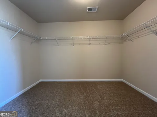 a view of a room with racks on the wall