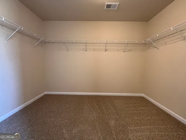 a view of an empty walk in closet