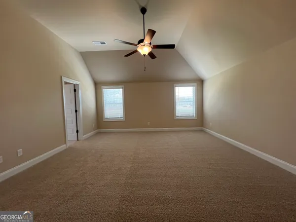 a view of empty room with windows