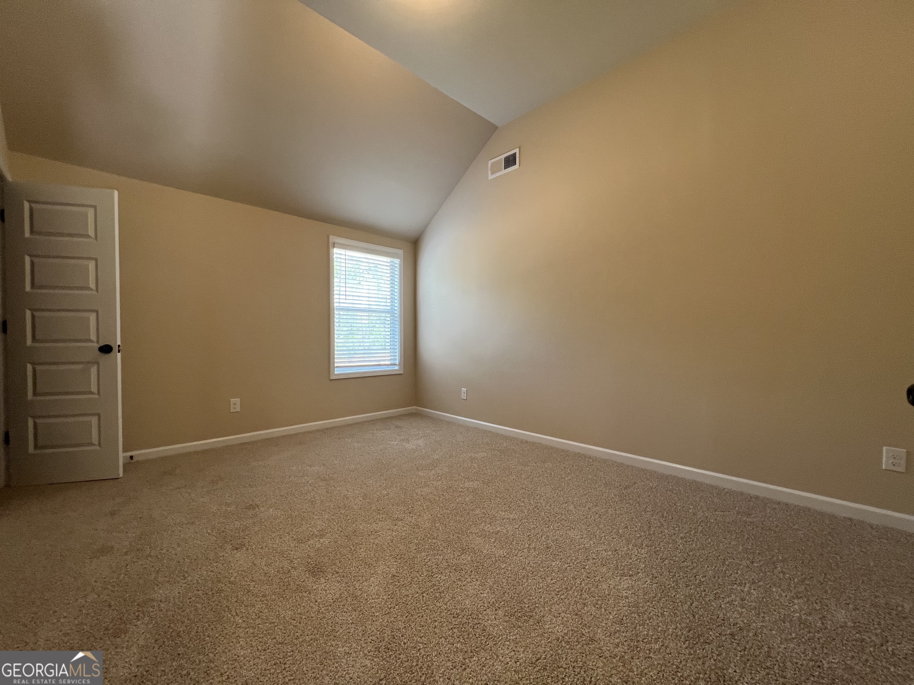 341 Homestead Circle Forsyth, GA 31029 - Photo 30 of 38 an empty room with windows