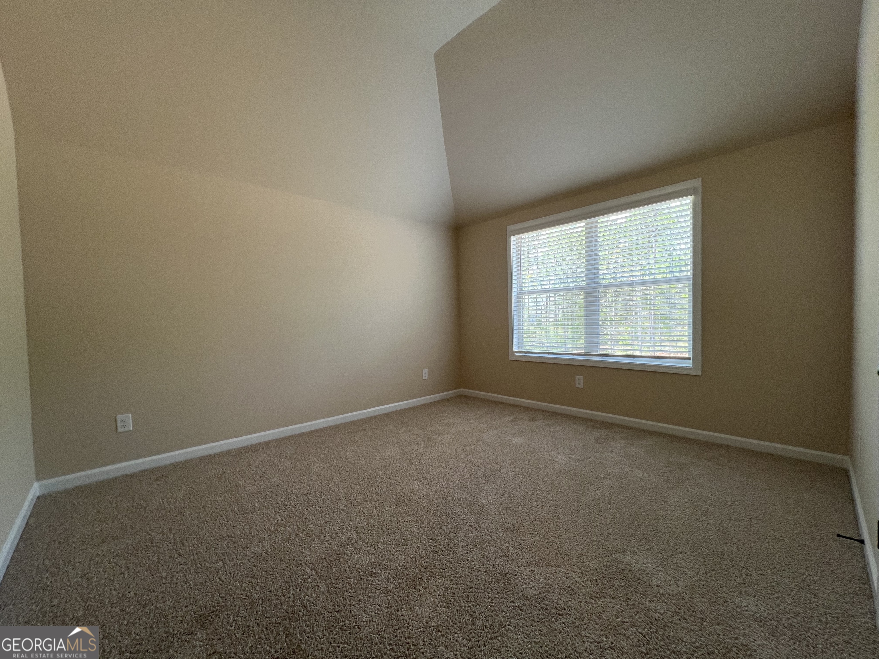341 Homestead Circle Forsyth, GA 31029 - Photo 31 of 38 an empty room with a window