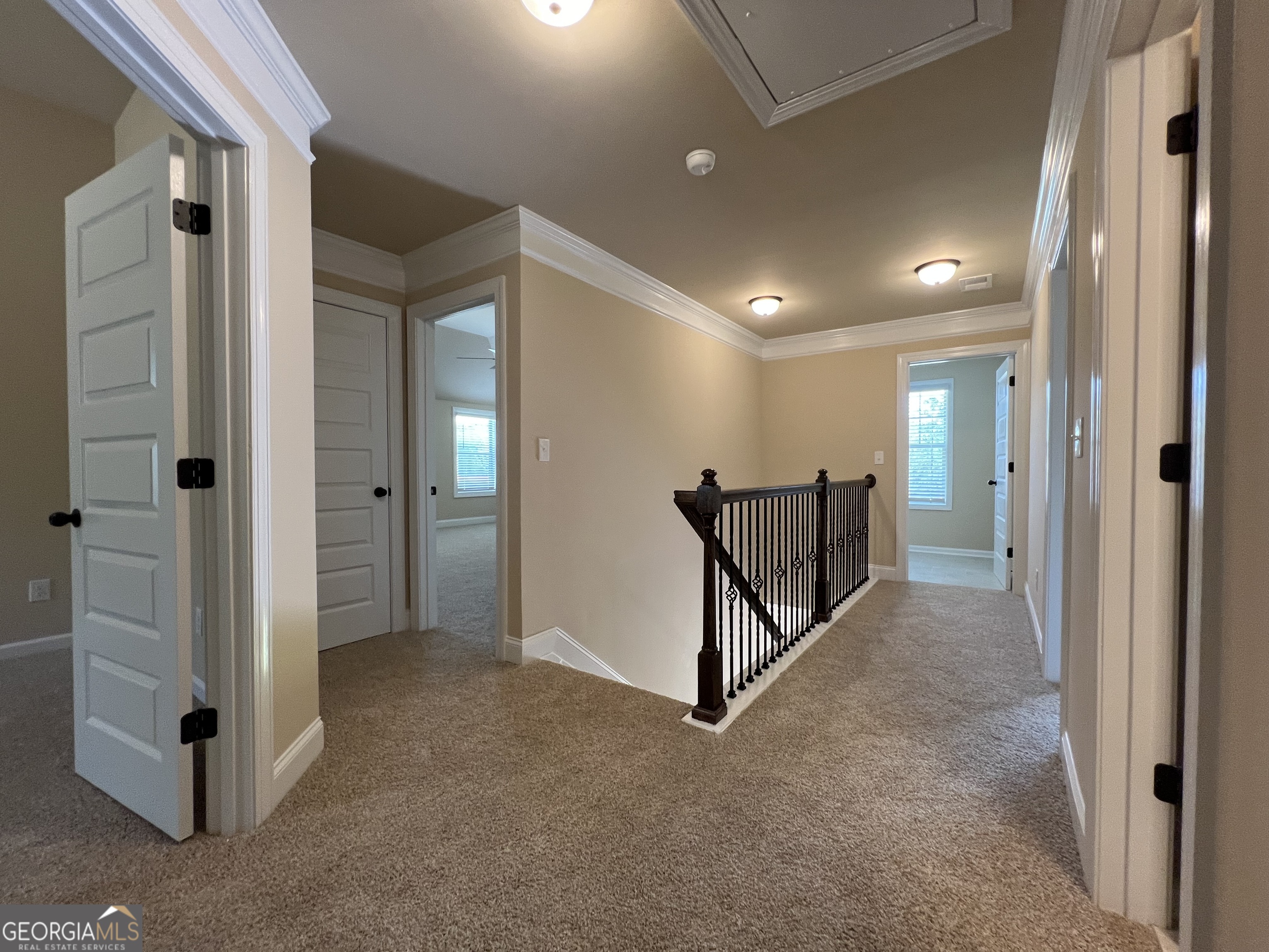 341 Homestead Circle Forsyth, GA 31029 - Photo 35 of 38 wooden view of a hallway with closet