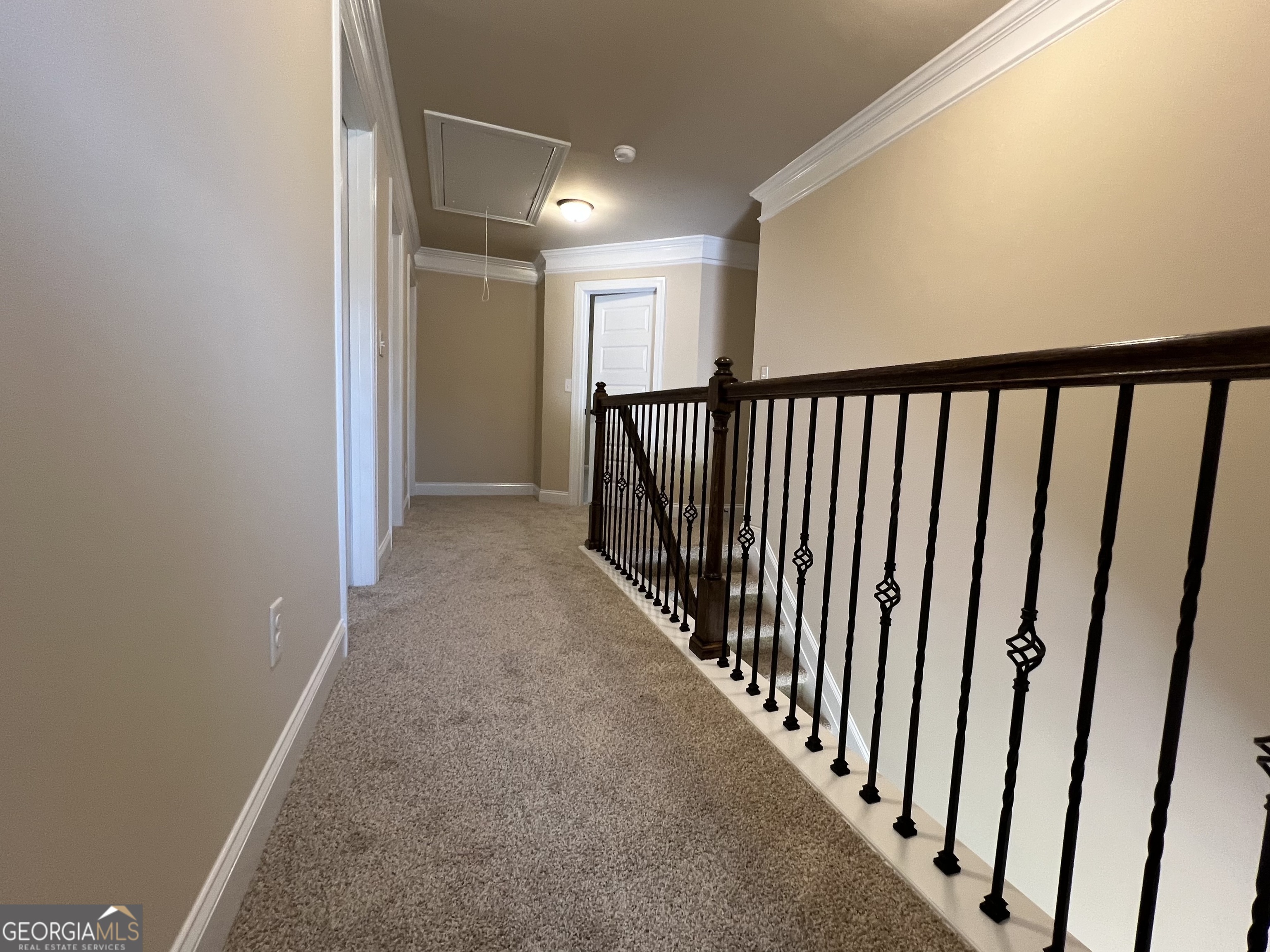 341 Homestead Circle Forsyth, GA 31029 - Photo 37 of 38 a view of a hallway with stairs