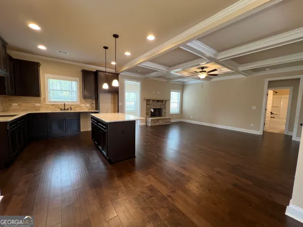 a large kitchen with lots of counter space a sink and appliances