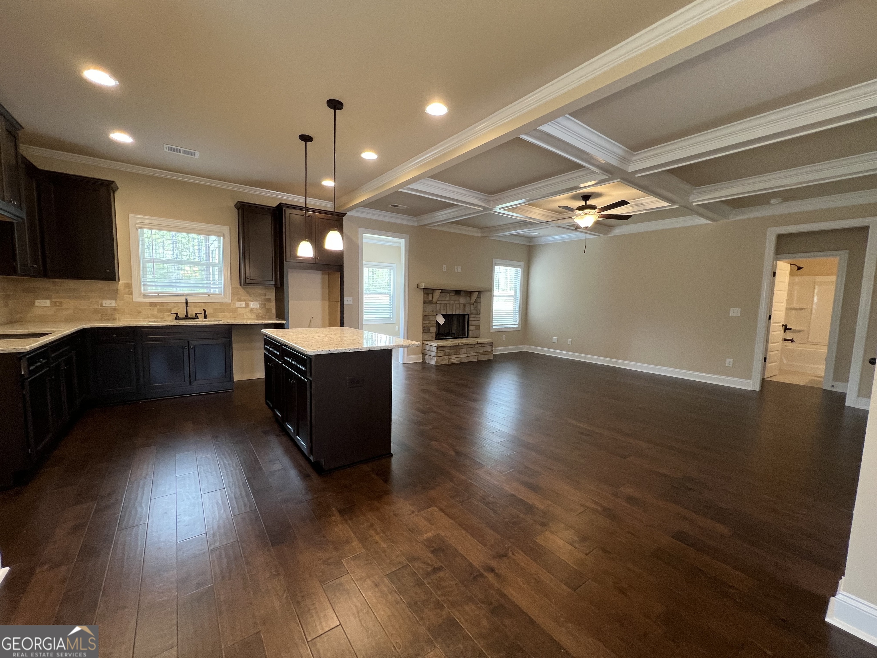 341 Homestead Circle Forsyth, GA 31029 - Photo 8 of 38 a large kitchen with lots of counter space a sink and appliances