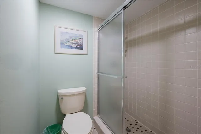 a bedroom with two beds and painting on the wall