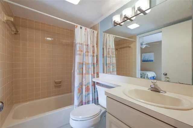 a balcony with chairs and potted plants