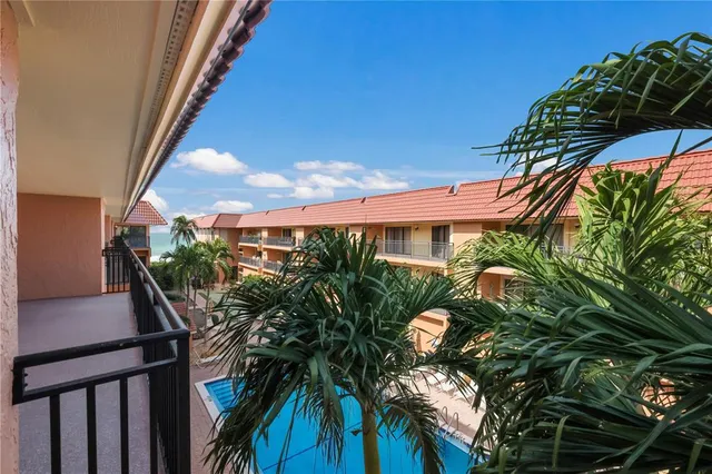 a kitchen with stainless steel appliances granite countertop a sink a stove a microwave and cabinets