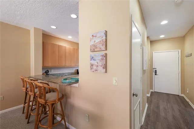 a view of a dining area with furniture and wooden floor