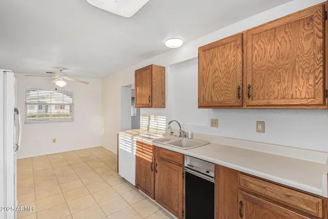 a kitchen with stainless steel appliances a stove a sink and a refrigerator