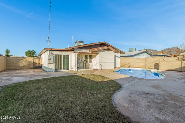a view of a swimming pool with a lounge chair