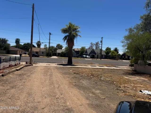 a view of a swimming pool with a yard