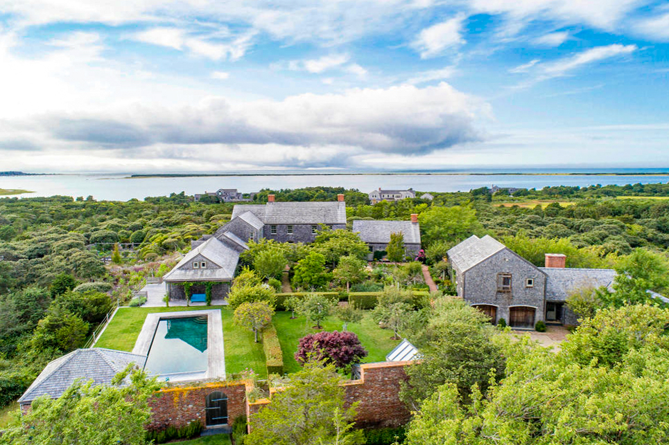 an aerial view of a house with lots of trees