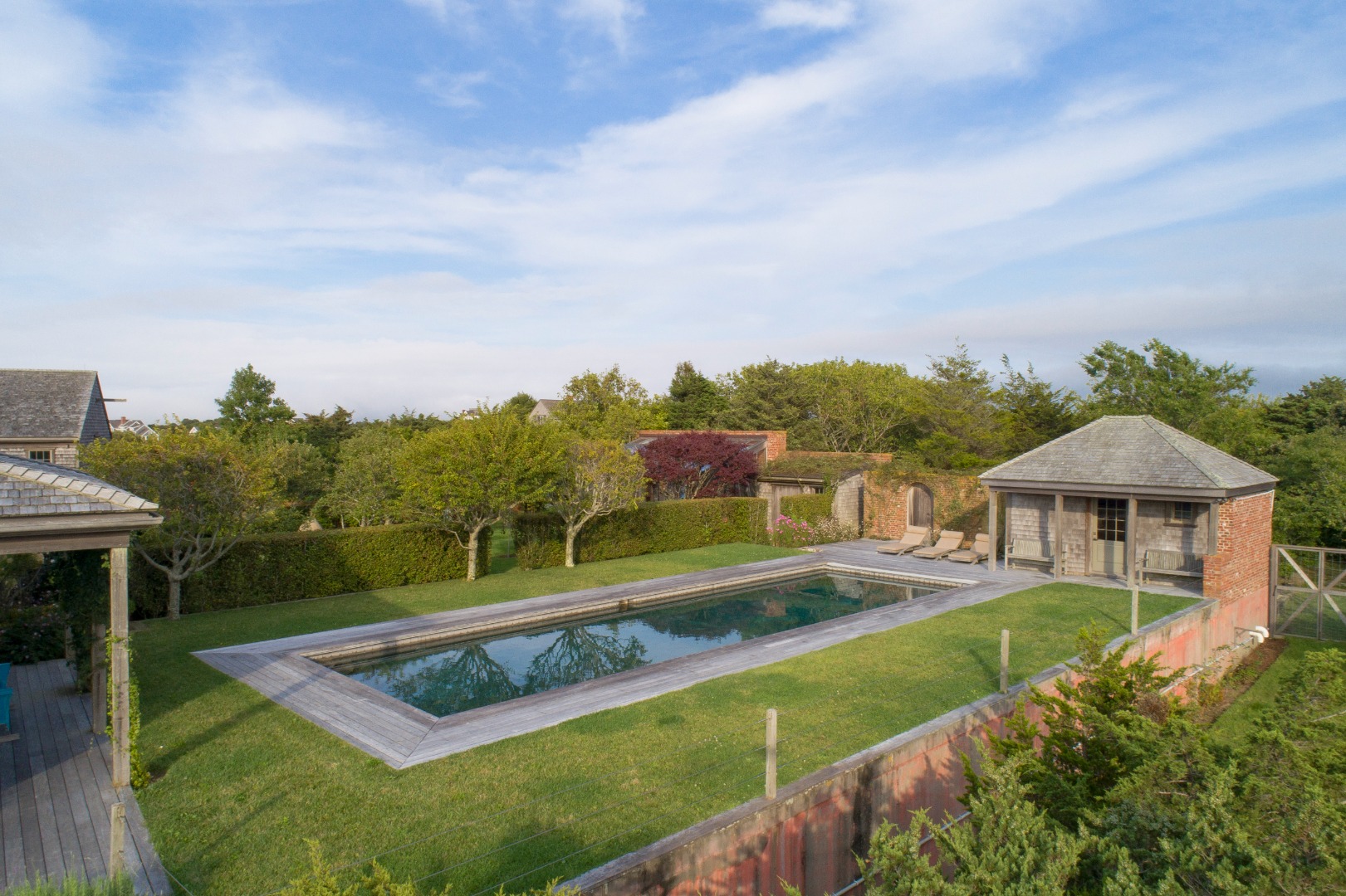 35 Shawkemo Road Nantucket, MA 02554 - Photo 30 of 53 a view of a house with swimming pool and yard