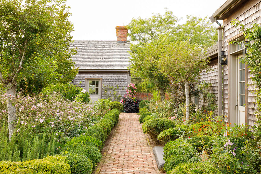 35 Shawkemo Road Nantucket, MA 02554 - Photo 10 of 53 a view of a pathway with flower garden