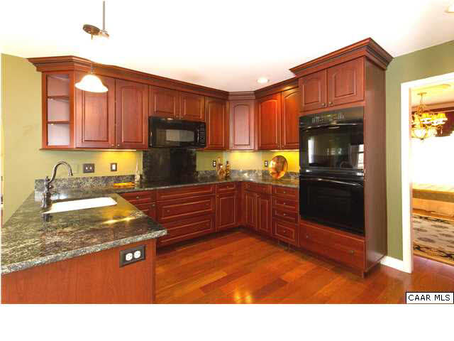 66 Amethyst Road Palmyra, VA 22963 - Photo 3 of 30 a kitchen with granite countertop a refrigerator stove and sink