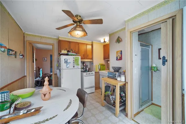 a kitchen with stainless steel appliances granite countertop a refrigerator and microwave