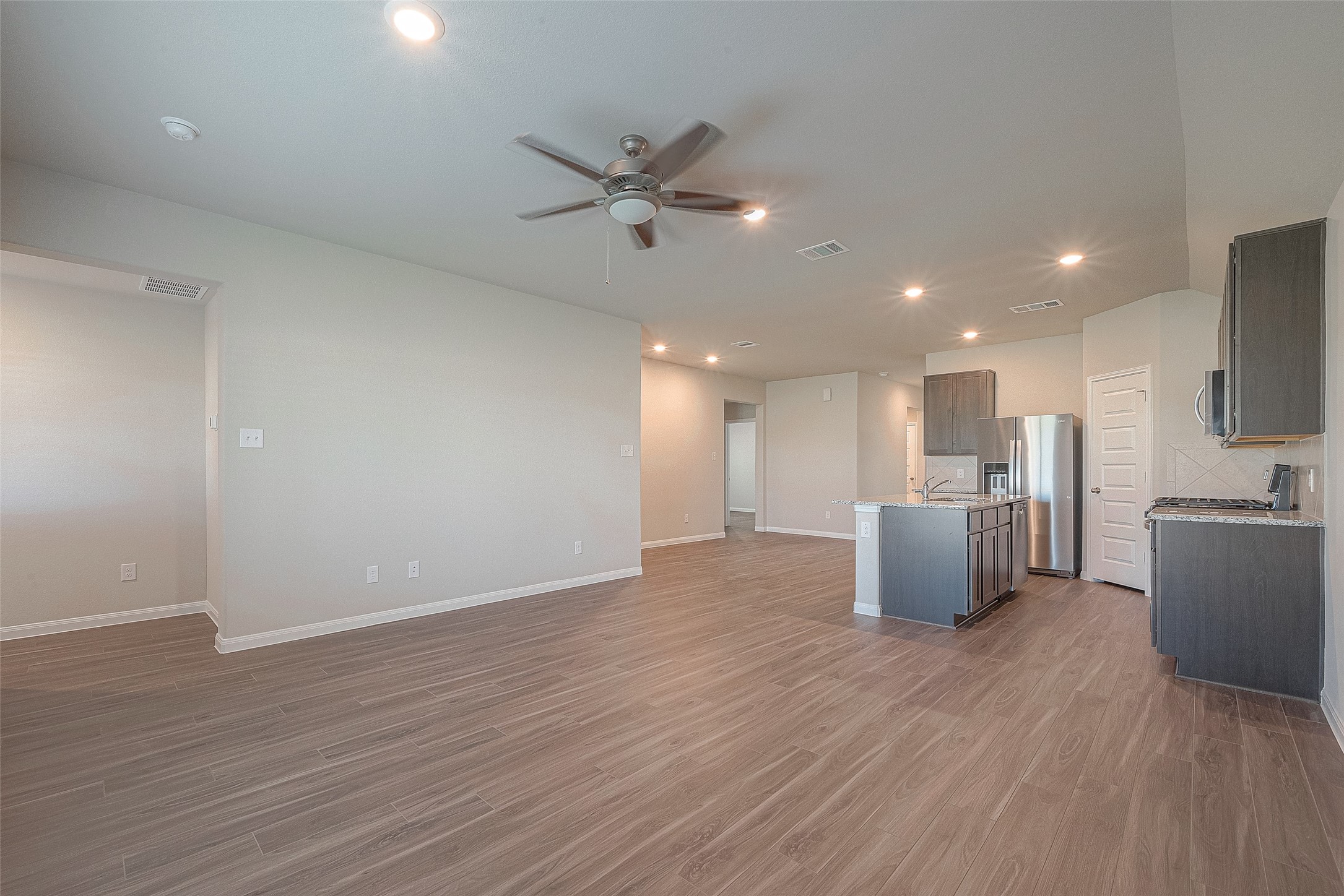5318 Briana Dee Drive Rosharon, TX 77583 - Photo 14 of 29 a view of a kitchen with wooden floor and a sink