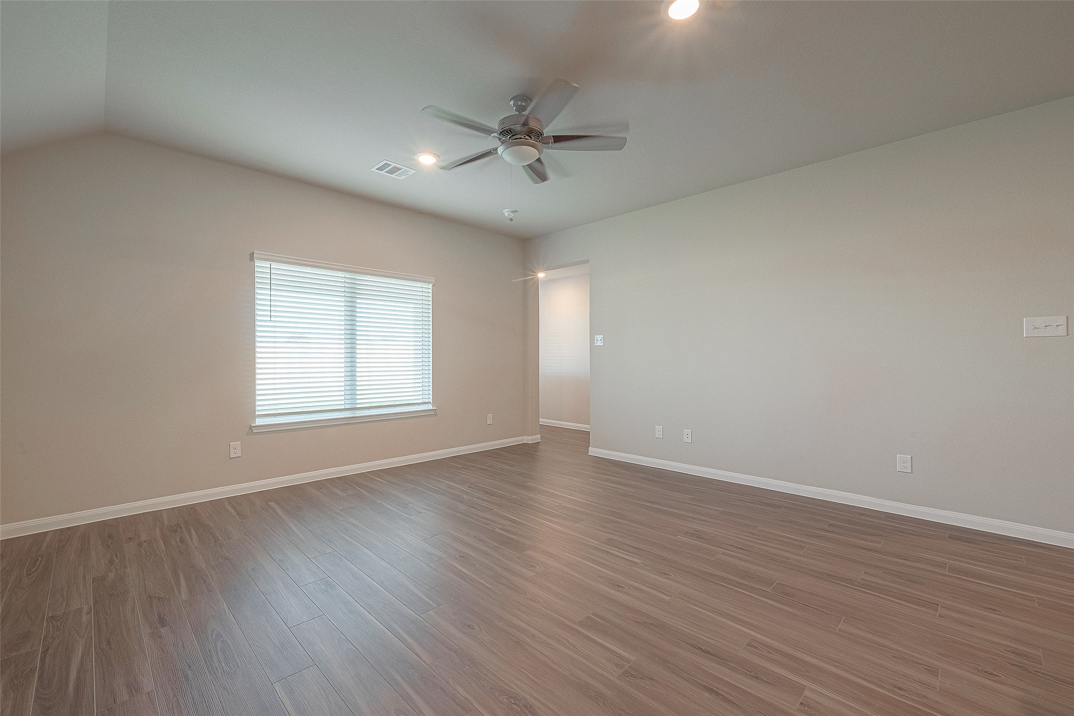 5318 Briana Dee Drive Rosharon, TX 77583 - Photo 15 of 29 an empty room with wooden floor fan and windows