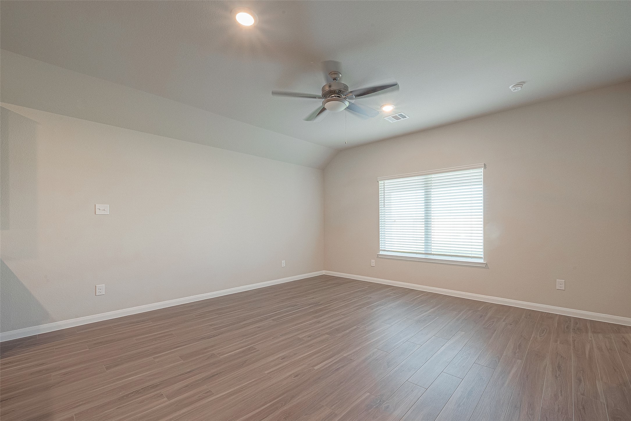 5318 Briana Dee Drive Rosharon, TX 77583 - Photo 17 of 29 an empty room with wooden floor ceiling fan and windows