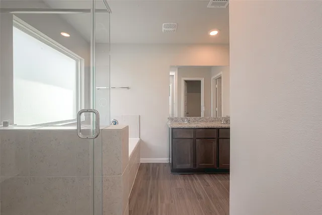a bathroom with a sink a vanity and mirror