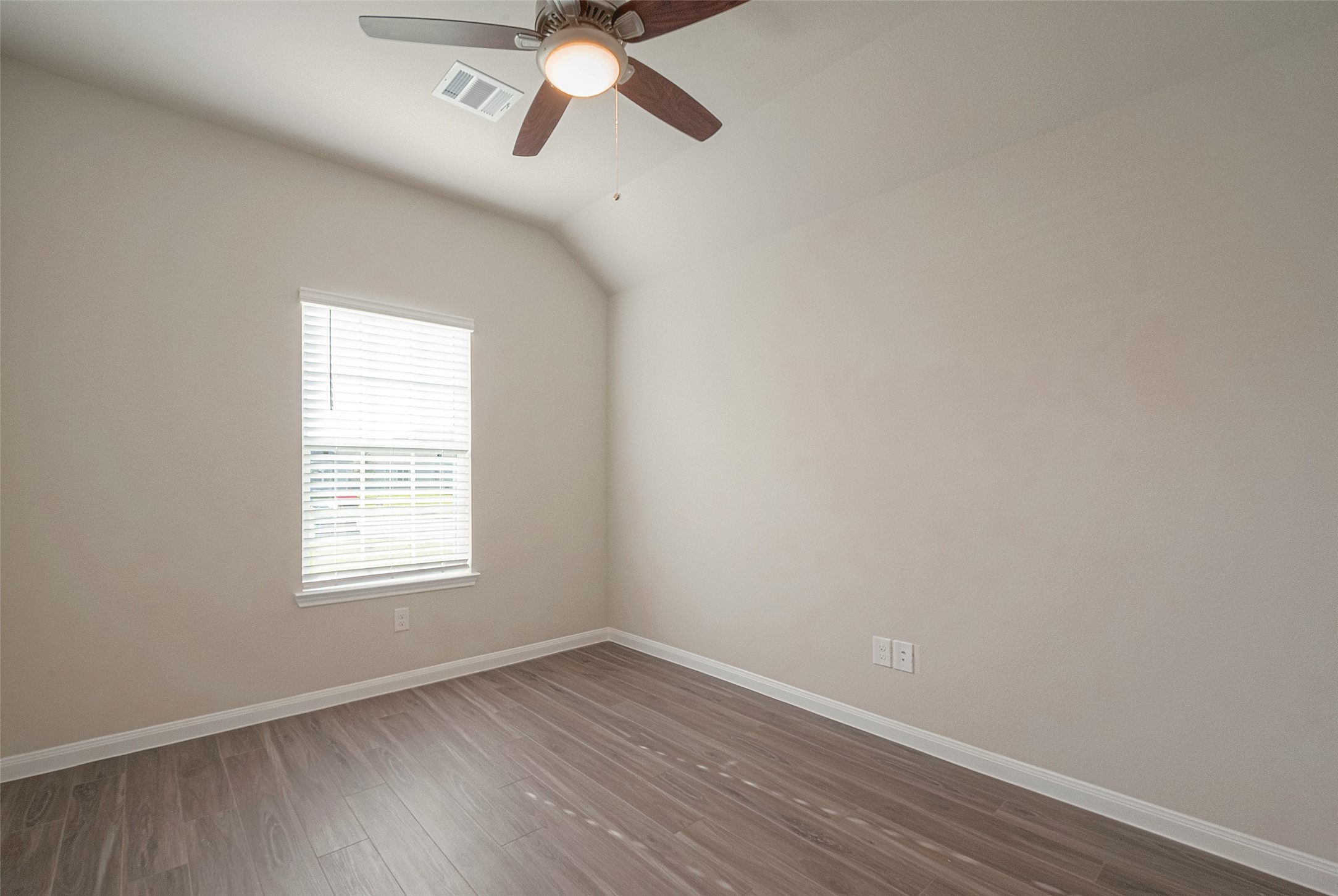 5318 Briana Dee Drive Rosharon, TX 77583 - Photo 8 of 29 an empty room with wooden floor fan and windows