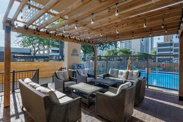 a outdoor living space with patio furniture and garden view