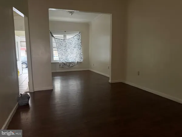 a kitchen with a stove top oven and cabinets