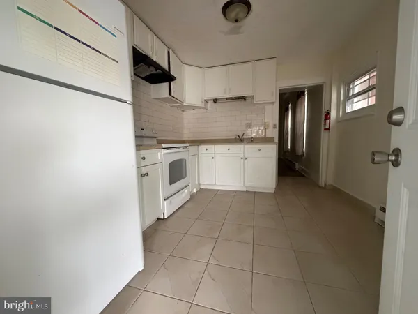 a room with a door open to a room