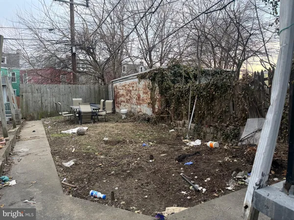 a brick oven sitting next to a brick wall