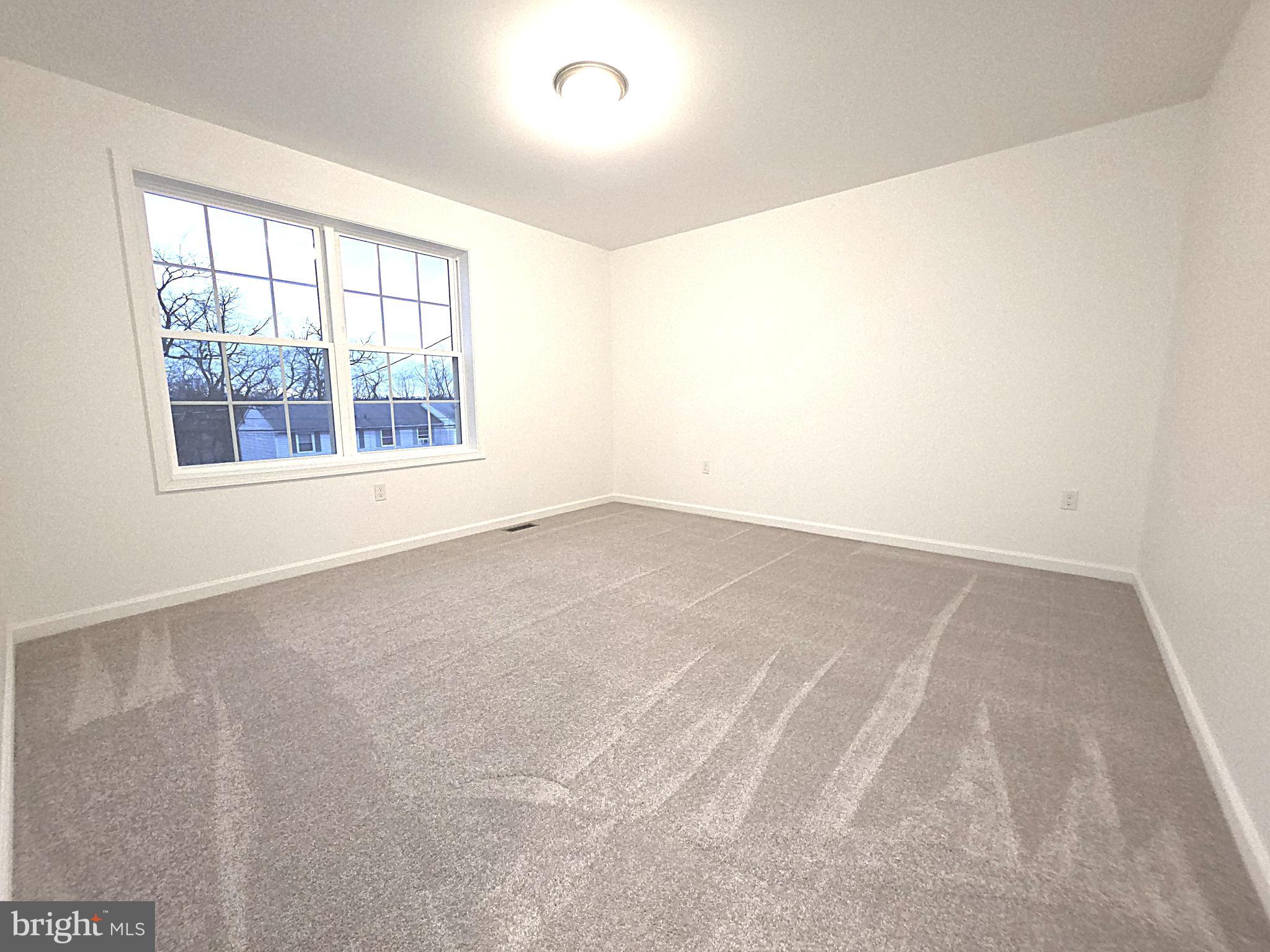 108 Bungalow Road Enola, PA 17025 - Photo 20 of 23 an empty room with windows