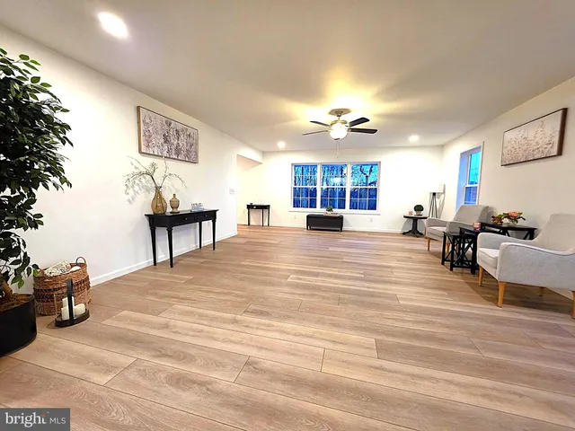a view of living room with furniture and a chandelier