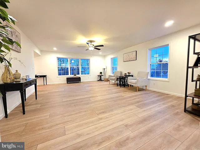 a living room with furniture window and a table