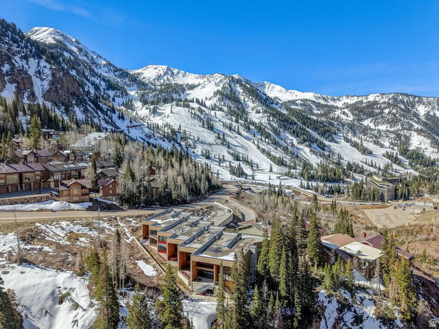 9699 Bypass Road, Unit 5 Alta, UT 84092 - Photo 54 of 54 Expansive mountain landscape featuring snow-covered peaks, dense evergreen forests, and multiple residential structures