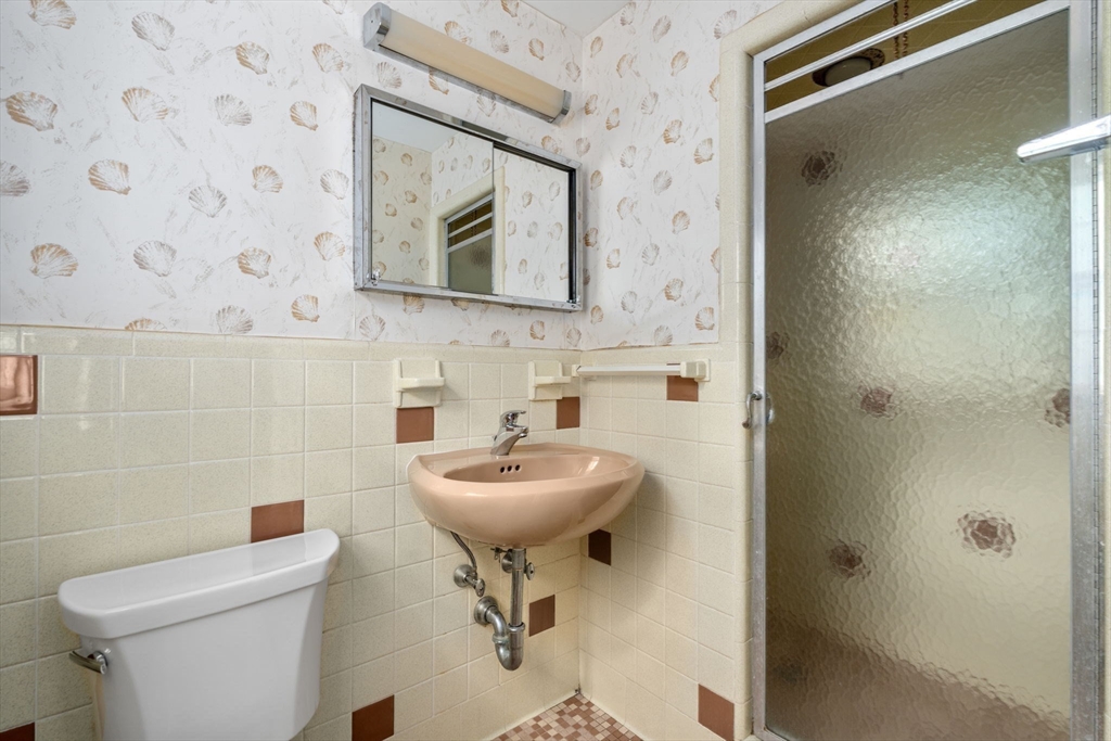 209 Bristol Road Wellesley, MA 02481 - Photo 20 of 29 a bathroom with a toilet sink and mirror