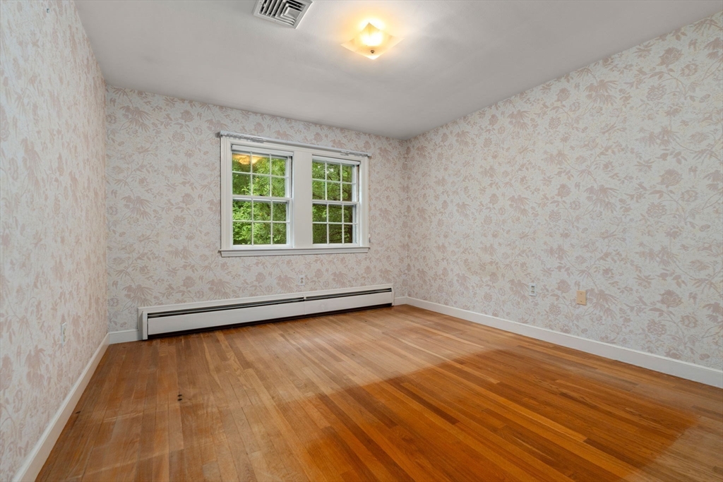 209 Bristol Road Wellesley, MA 02481 - Photo 21 of 29 wooden floor in an empty room with a window