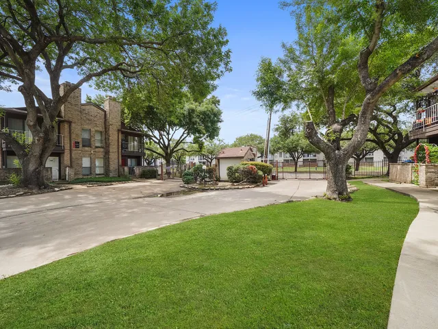 a view of street with parked cars
