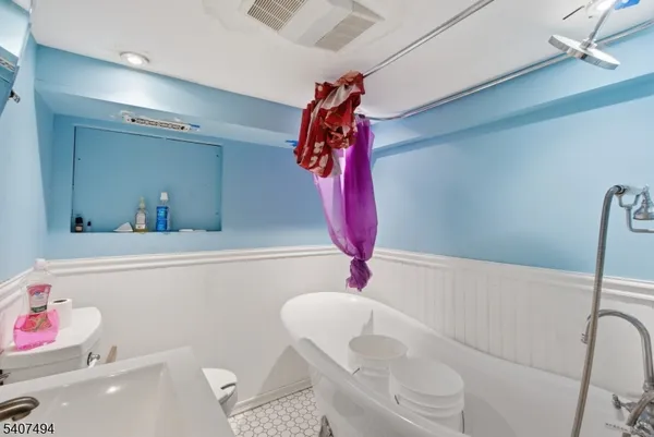 a bed room with a bed and a walk in closet