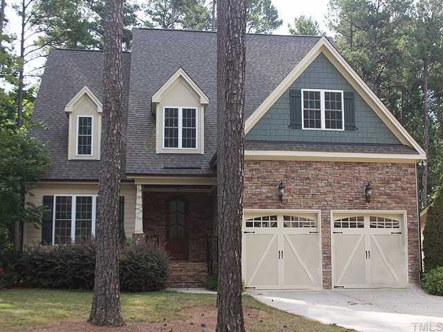 9108 Wellsley Way Raleigh, NC 27613 - Photo 1 of 14 a front view of a house with garage