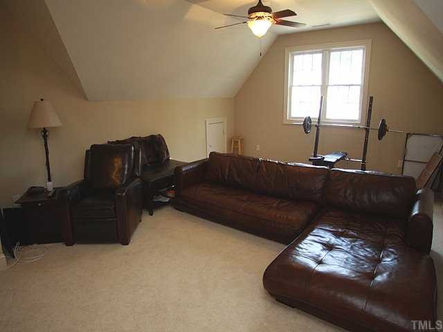 9108 Wellsley Way Raleigh, NC 27613 - Photo 8 of 14 a living room with furniture and a window