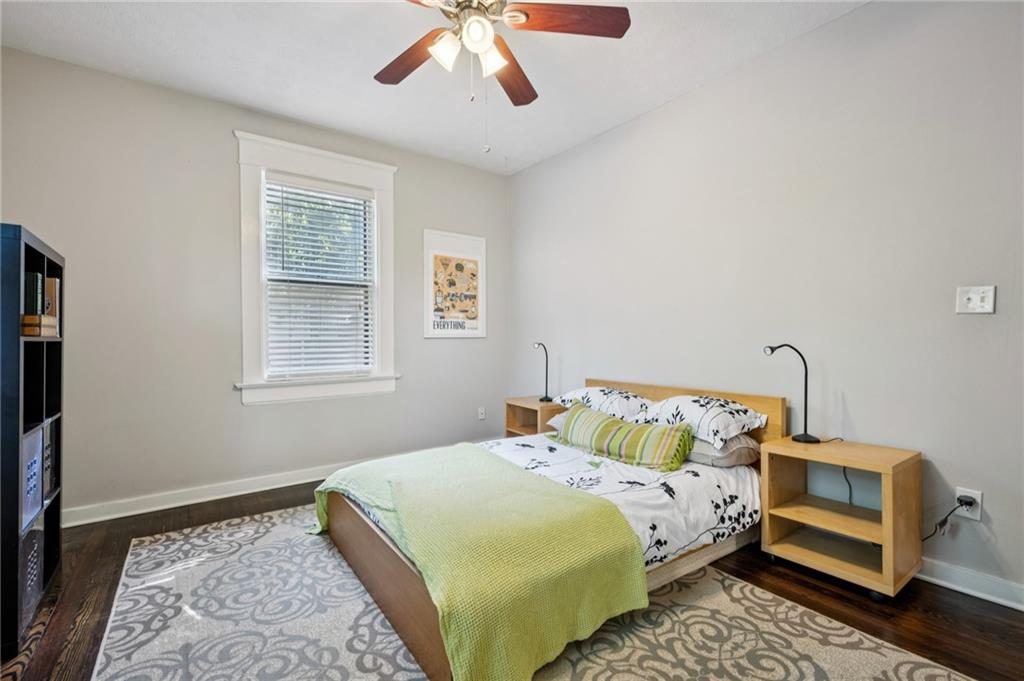 926 Waverly Way Northeast, Unit F Atlanta, GA 30307 - Photo 18 of 33 a bedroom with a bed and wooden floor