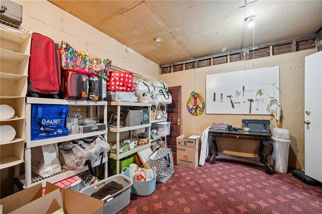 926 Waverly Way Northeast, Unit F Atlanta, GA 30307 - Photo 21 of 33 a room with lots of different colored cloths