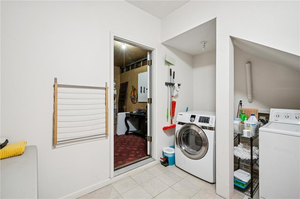 926 Waverly Way Northeast, Unit F Atlanta, GA 30307 - Photo 22 of 33 a utility room with dryer and washer
