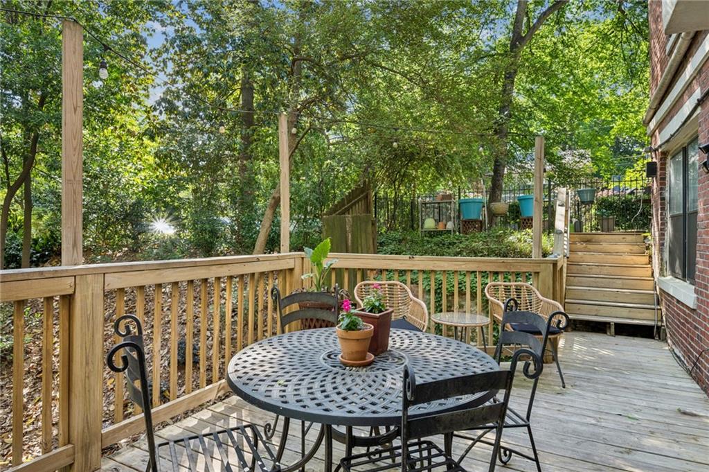 926 Waverly Way Northeast, Unit F Atlanta, GA 30307 - Photo 24 of 33 a view of balcony with wooden floor and outdoor seating