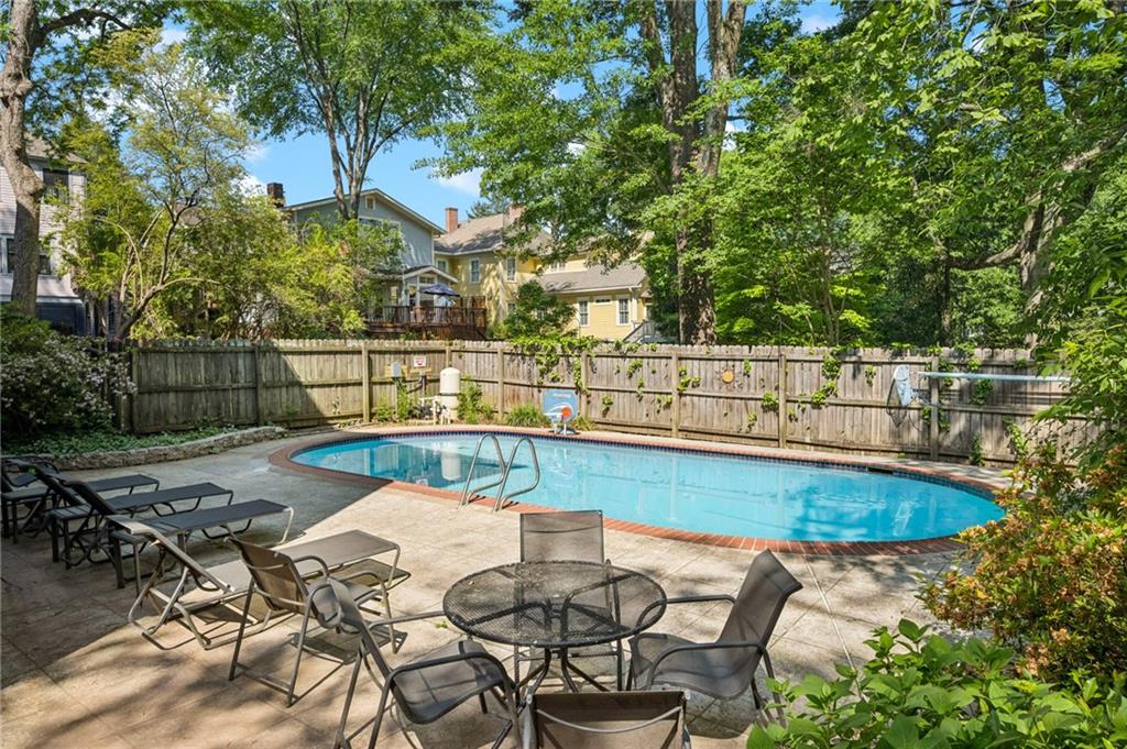 926 Waverly Way Northeast, Unit F Atlanta, GA 30307 - Photo 30 of 33 a view of a swimming pool with outdoor seating